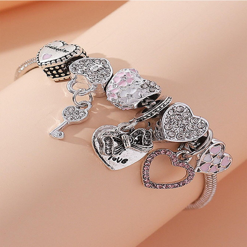 Серебристый браслет с романтичными подвесками-сердцами CJR68560 Серебристый браслет с романтичными подвесками-сердцами CJR68560