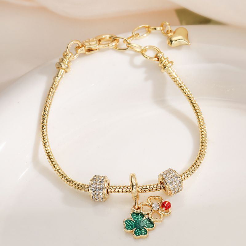 Золотистый браслет с подвесками-талисманами CJL20462