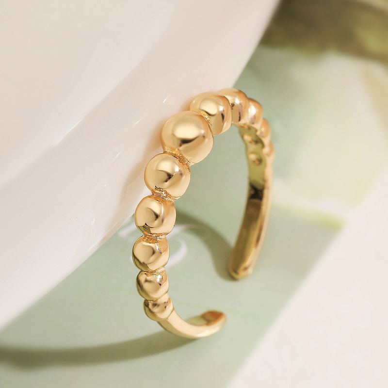 Разомкнутая дорожка из круглых фианитов в золотистой оправе CJL20481