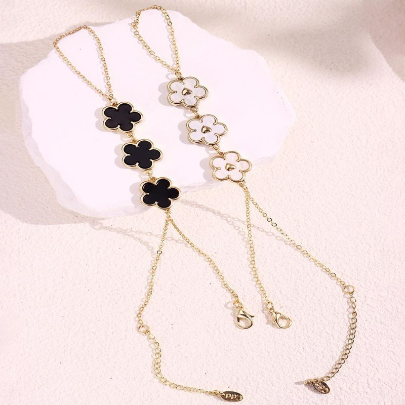 Браслет слейв трио черных цветов на золотой цепи