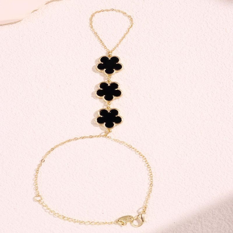 Браслет слейв трио черных цветов на золотой цепи