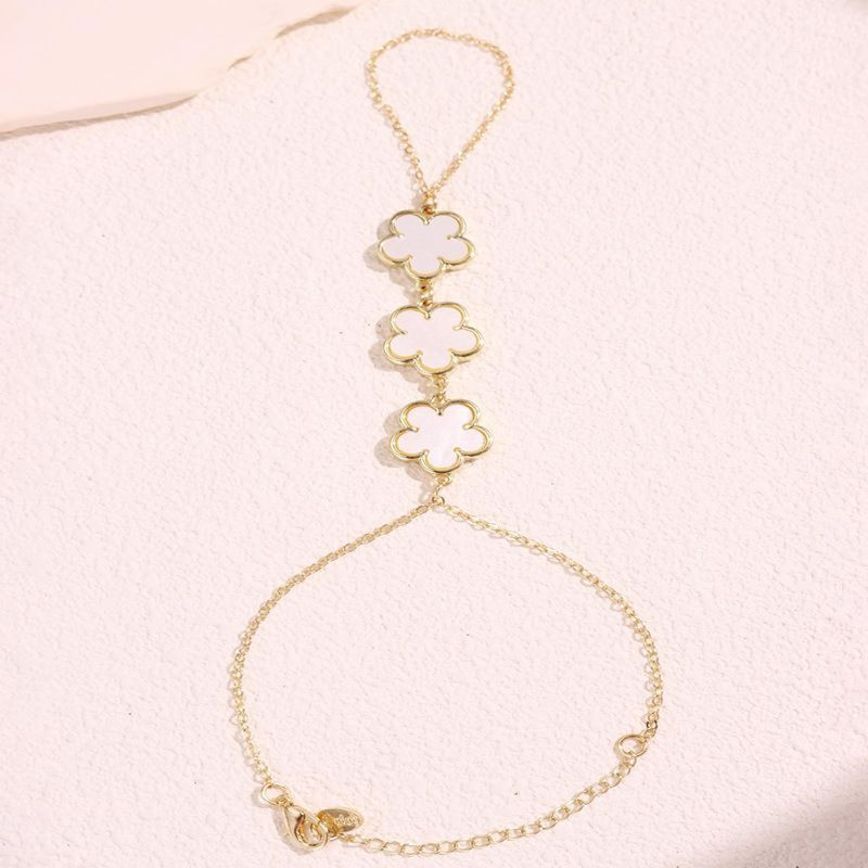 Браслет слейв трио черных цветов на золотой цепи