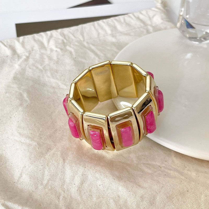 Браслет жесткий шарнирный с цветными вставками под камень CJN37504