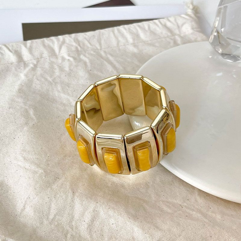 Браслет жесткий шарнирный с цветными вставками под камень CJN37504