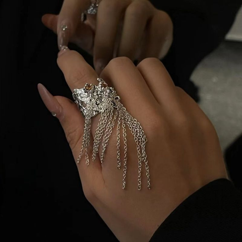 Длинное ажурное кольцо с ниспадающими цепочками 1J12243CJJ