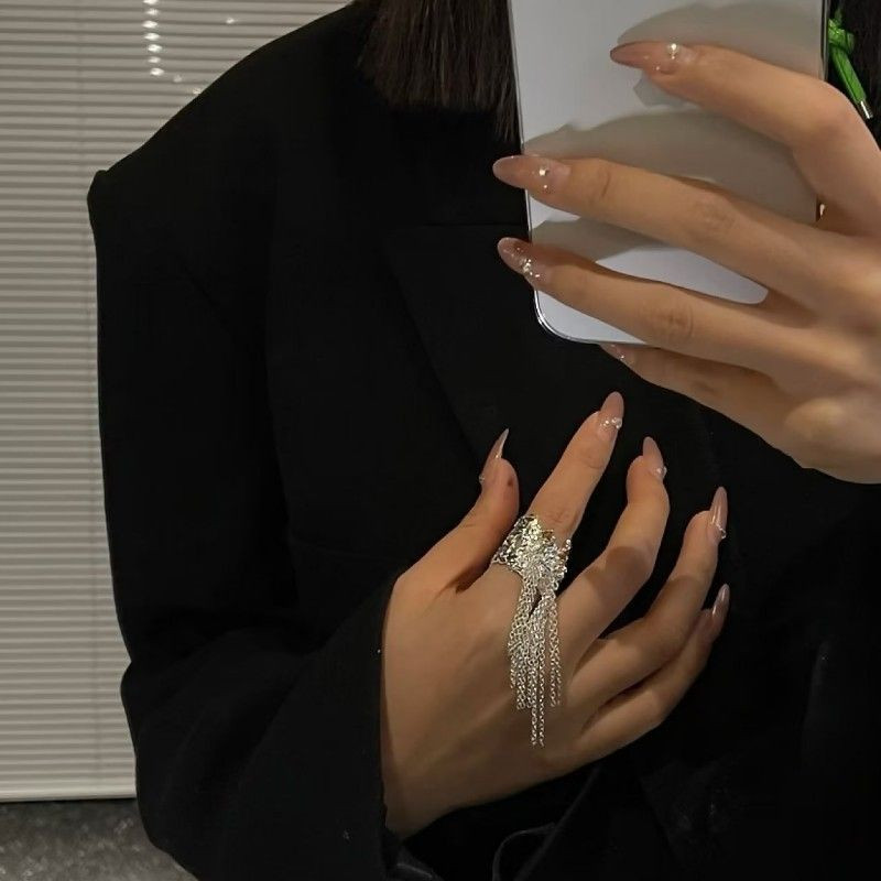 Длинное ажурное кольцо с ниспадающими цепочками 1J12243CJJ