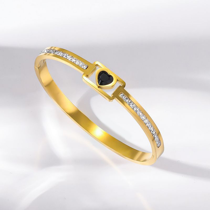 Браслет жесткий золотистый с акцентным камнем и дорожками CJN67496 Браслет жесткий золотистый с акцентным камнем и дорожками CJN67496