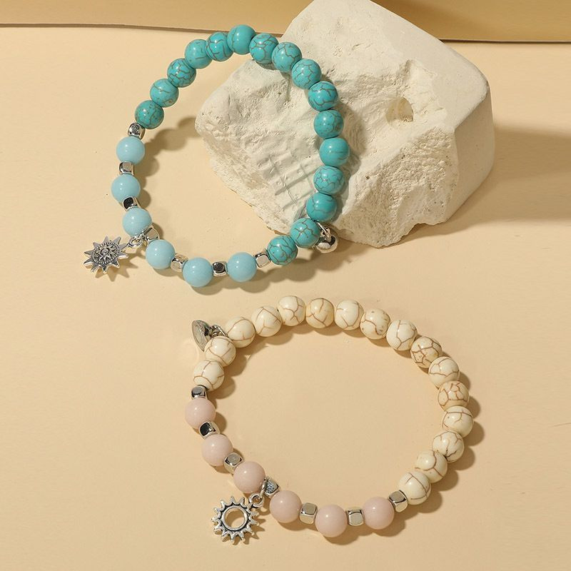 Парные браслеты солнечный берег с подвесками-цветами R19776