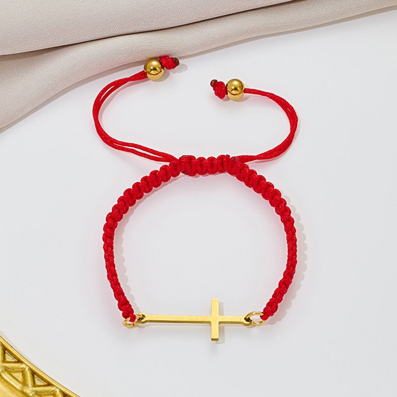 Браслет плетеная нить с длинным золотистым крестом CJQ65917