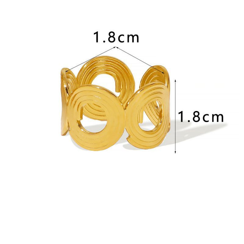 Широкое ажурное кольцо с геометрическим узором из кругов CJM30191