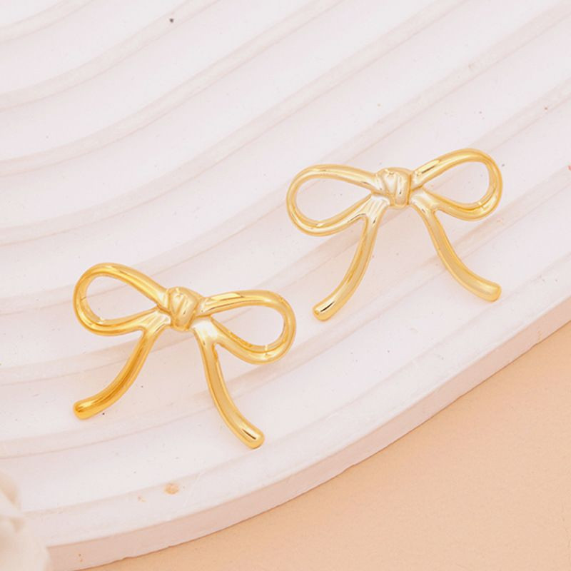 Романтичные серьги-пусеты Тонкие золотистые банты CJH31007