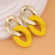 Крупные желтые серьги из матового пластика с фактурными кольцами 2V44892МСК