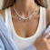 Серебряное колье с крестом и жемчугом CJZ29460
