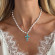 Серебряное колье с крестом и жемчугом CJZ29460