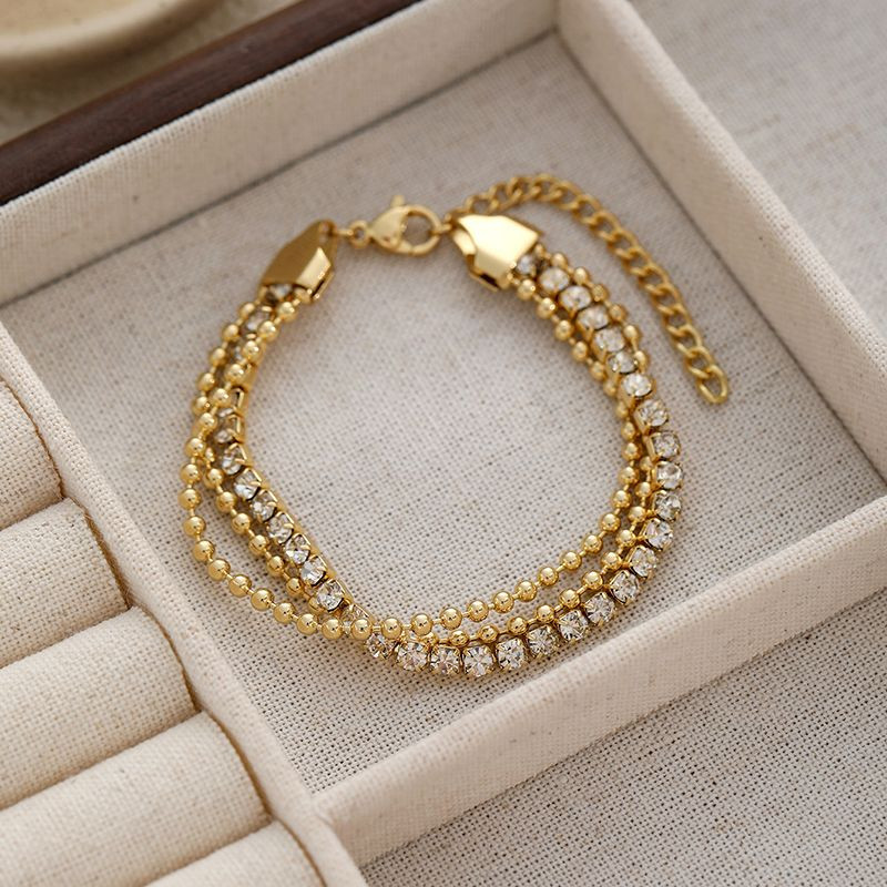 Браслет многослойный с розовым бисером и золотистыми цепями CJN91343