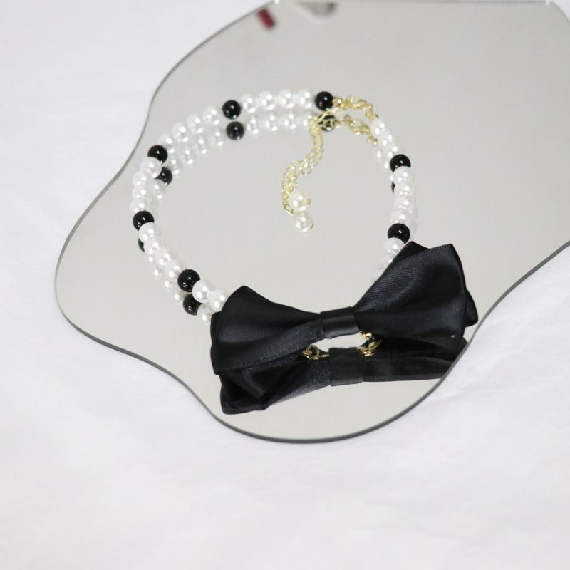 Чокер из жемчуга с объемным текстильным бантом в классическом стиле CJH89222