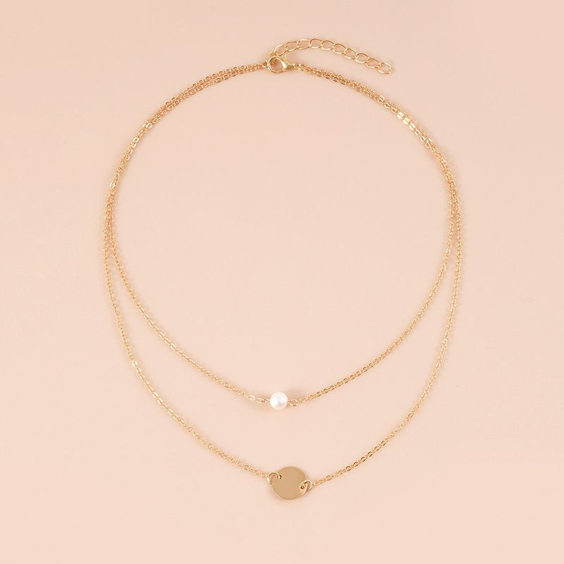 Двойная золотистая цепочка с жемчужиной и диском CJH35176