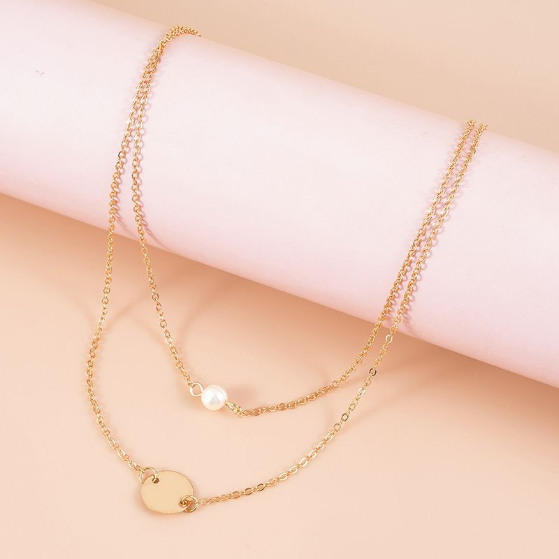 Двойная золотистая цепочка с жемчужиной и диском CJH35176