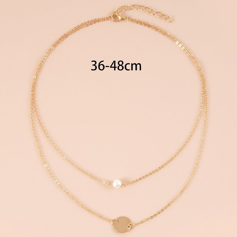 Двойная золотистая цепочка с жемчужиной и диском CJH35176