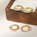 Компактные золотистые серьги-кольца с дорожкой мелкого жемчуга CJH38228 Компактные золотистые серьги-кольца с дорожкой мелкого жемчуга CJH38228