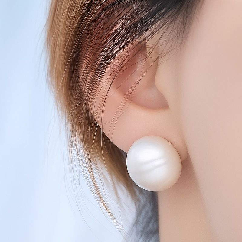 Серебристые стальные серьги-пусеты в форме крупных матовых сфер 1J12122CJJ