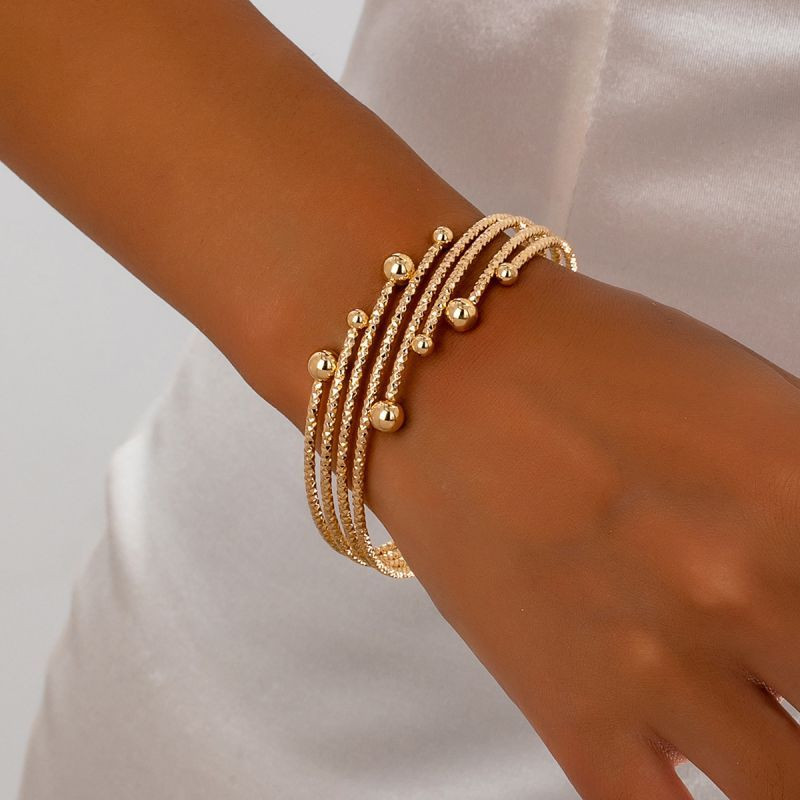 Браслет жесткий многорядный с декоративными узелками CJQ22072