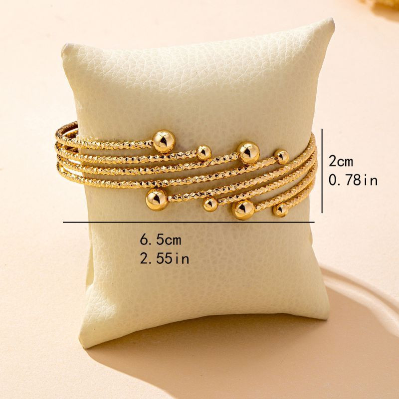 Браслет жесткий многорядный с декоративными узелками CJQ22072