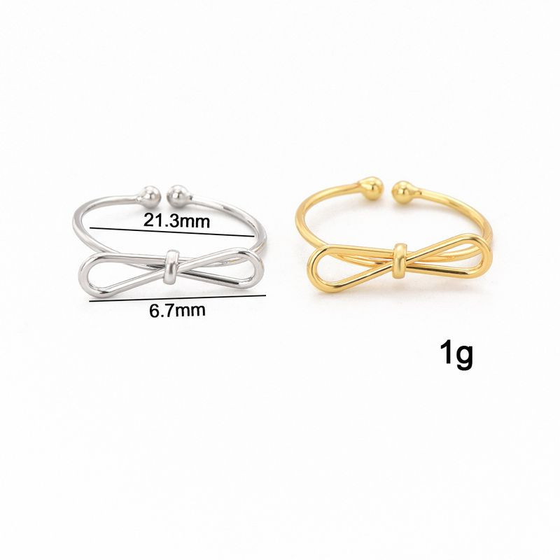 Кольцо с золотистым покрытием в форме изящного банта 1J12461CJJ