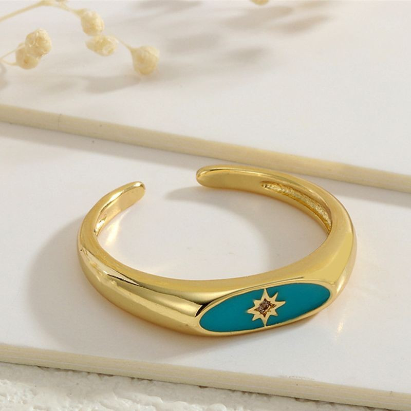 Кольцо-печатка с красной эмалью и декоративной восьмиконечной звездой CJG67690