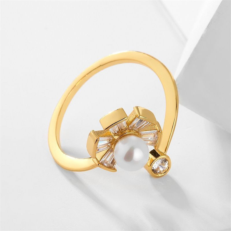 Кольцо разомкнутое с цветком и жемчужиной CJG26630