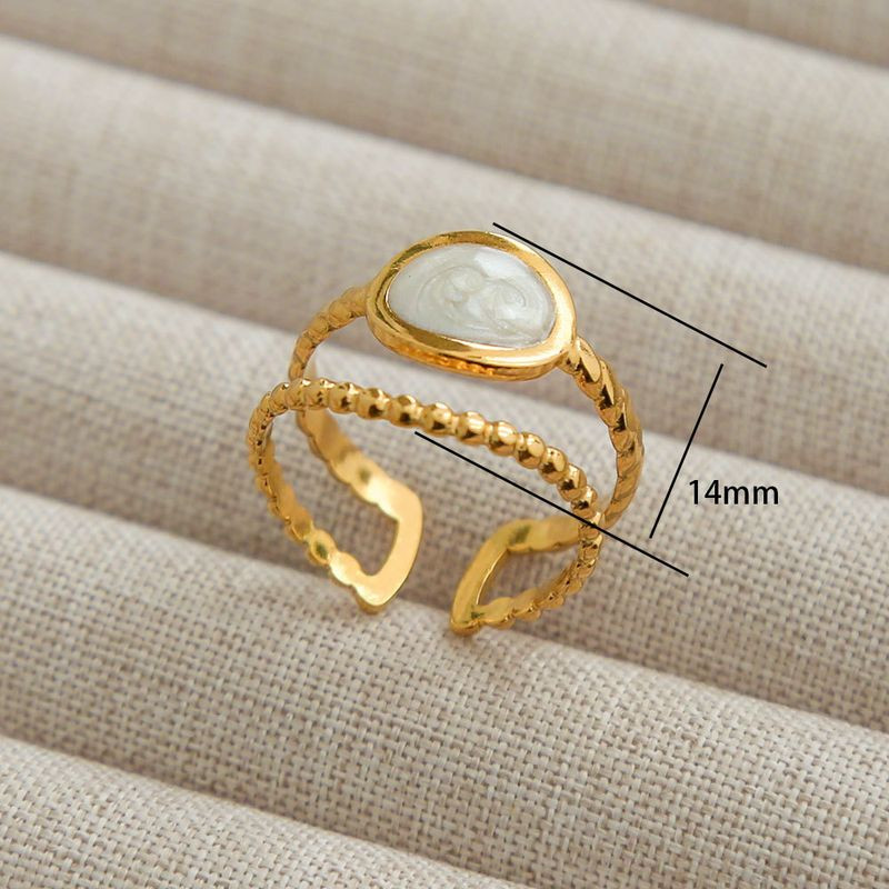 Двойное золотистое кольцо с вставкой из перламутра 1J12265CJJ Двойное золотистое кольцо с вставкой из перламутра 1J12265CJJ