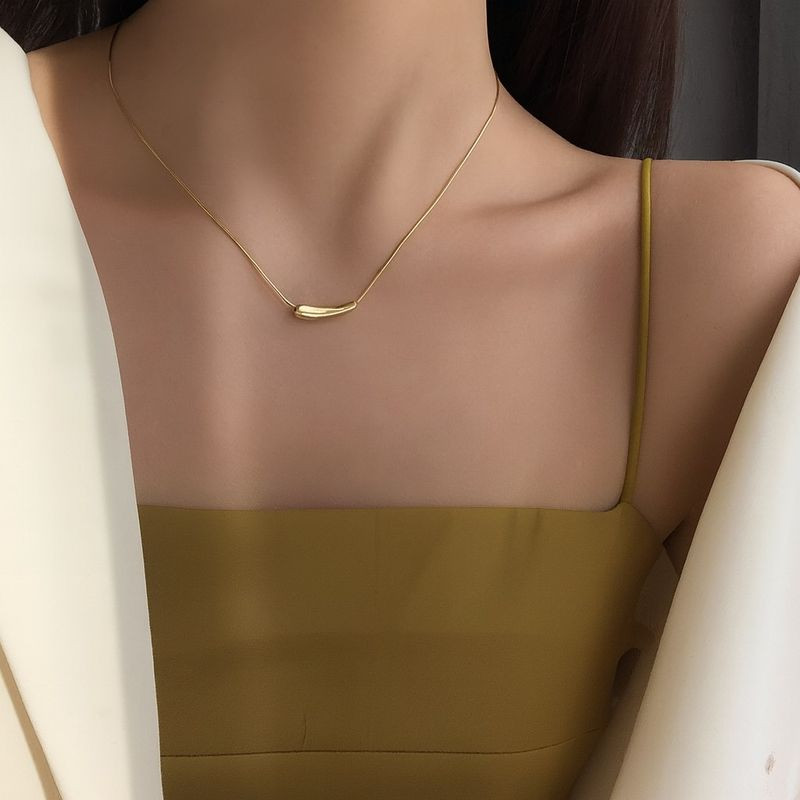 Золотистая гибкая цепочка с цилиндрической подвеской-бегунком 1J12491CJJ