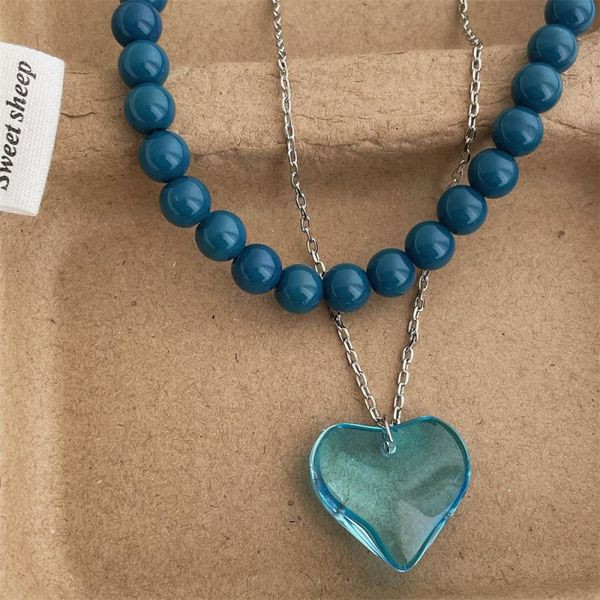 Двухслойное колье из синего бисера с серебристой подвеской CJL47500