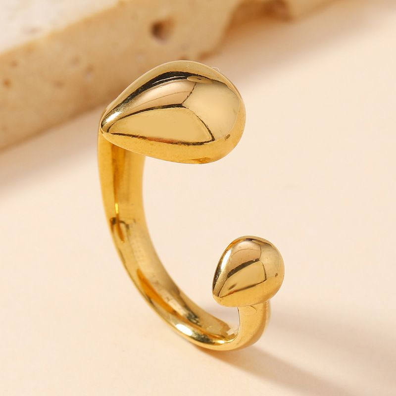 Разомкнутое кольцо с двумя каплевидными элементами в золоте CJH26668