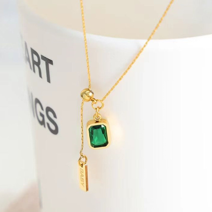 Колье-галстук с изумрудным кристаллом и золотистой планкой J10942CJJ