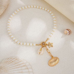 Жемчужный чокер с золотистым бантом и подвесками CJM15254