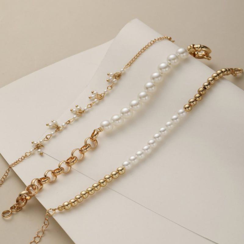 Комплект из 3 браслетов из жемчуга и цепей CJG34569 Комплект из 3 браслетов из жемчуга и цепей CJG34569