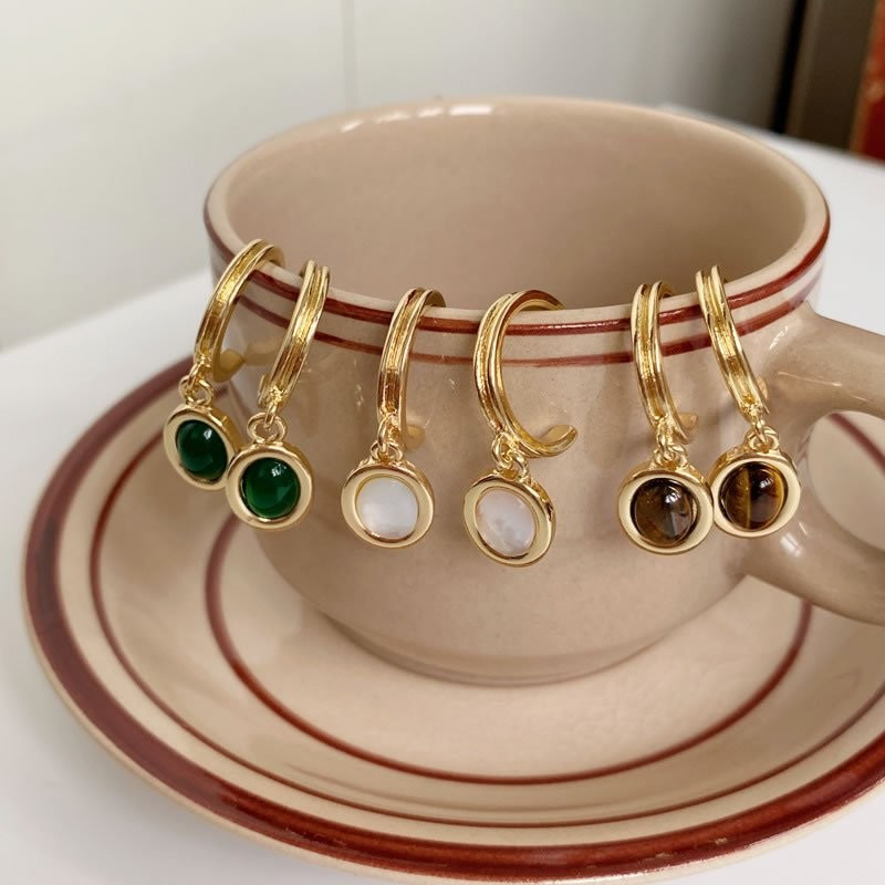 Золотистые серьги-конго с подвесками из изумрудных камней M94893