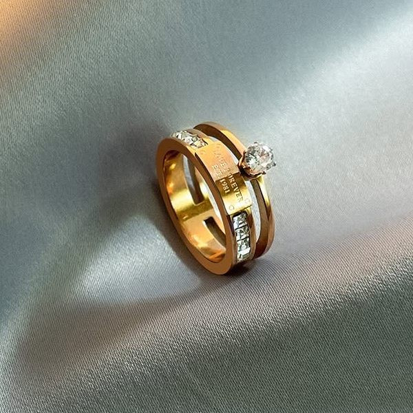 Двойное золотистое кольцо с центральным фианитом 1J11790CJJ