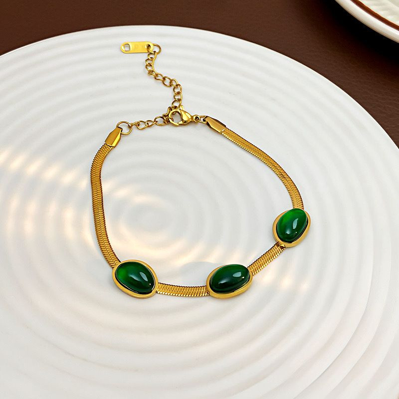 Браслет с изумрудными вставками в золотистой оправе CJL32478 Браслет с изумрудными вставками в золотистой оправе CJL32478