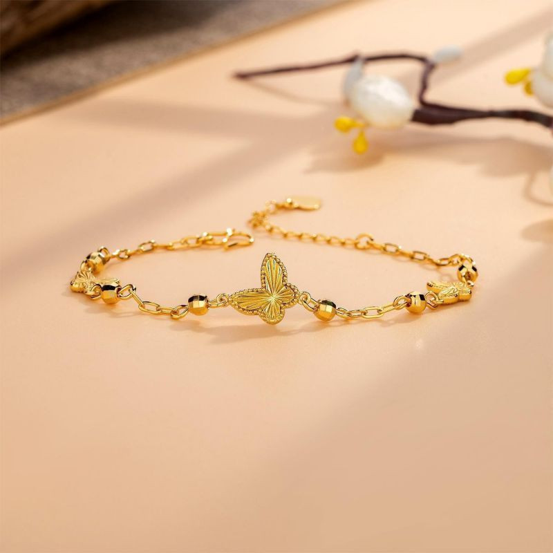 Золотистый браслет с подвесками-бабочками CJL32181