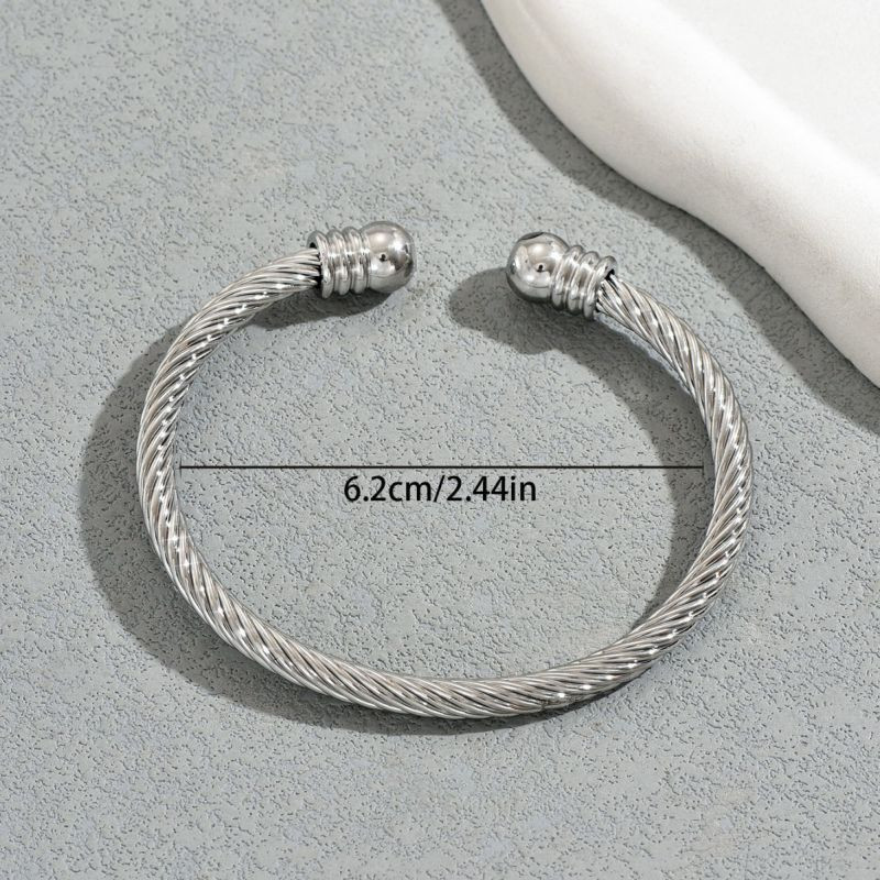 Браслет-жгут из стальных нитей с золотистыми наконечниками CJT17388