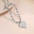 Серебряное колье из стали со снежинкой и сердцем CJZ56409