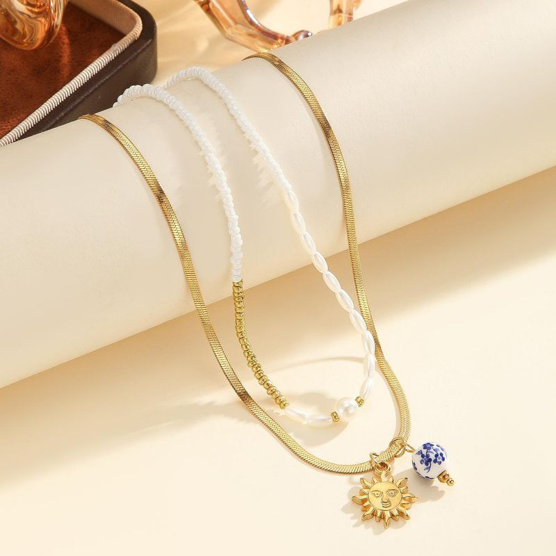 Двухслойное колье из жемчужной нити и цепи с камнями CJP80758 Двухслойное колье из жемчужной нити и цепи с камнями CJP80758