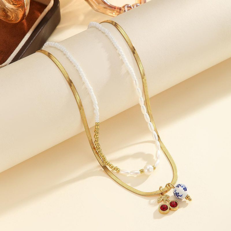 Двухслойное колье из жемчужной нити и цепи с камнями CJP80758 Двухслойное колье из жемчужной нити и цепи с камнями CJP80758