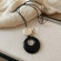 Длинный лариат с черным диском и тигровым глазом CJJ10429