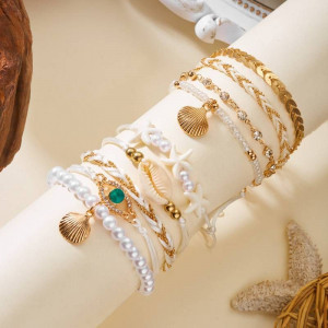 Комплект многорядных браслетов в золотистых тонах CJT06976