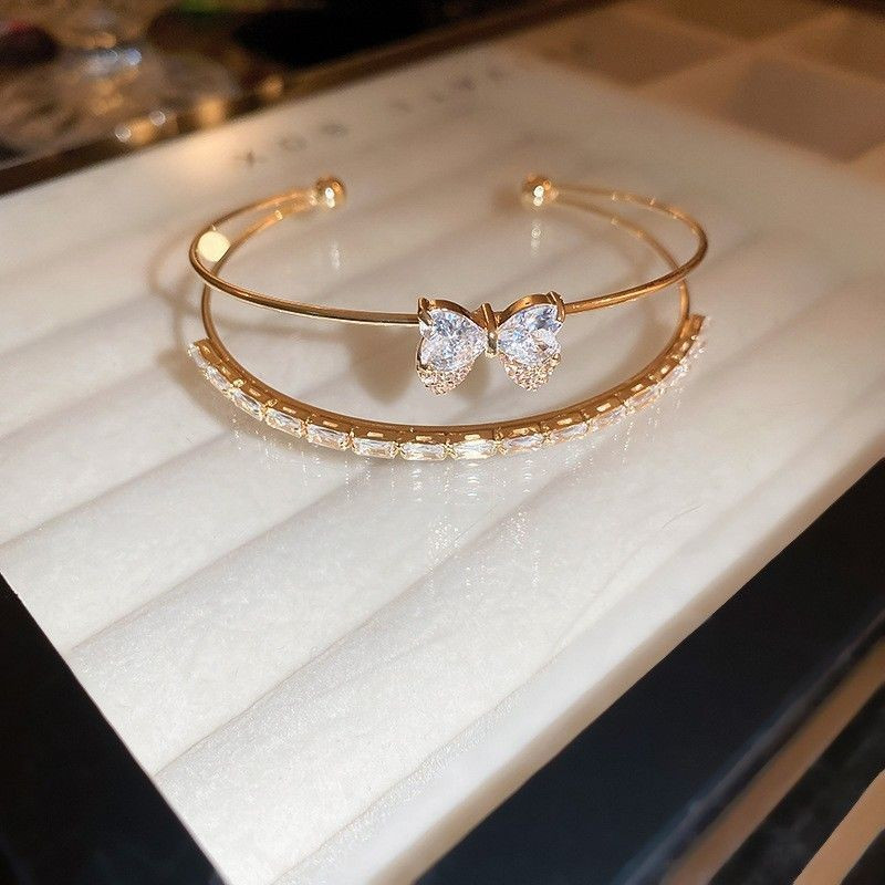 Жесткий разомкнутый браслет с бантом CJG59106 Жесткий разомкнутый браслет с бантом CJG59106