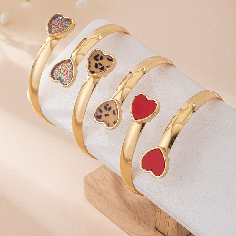 Браслет жесткий разомкнутый с декоративными леопардами CJM14392