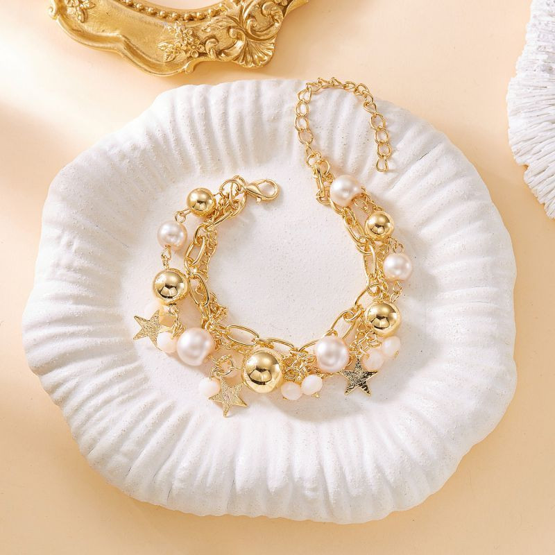 Браслет многорядный из золотистых цепей и бусин CJT15260 Браслет многорядный из золотистых цепей и бусин CJT15260